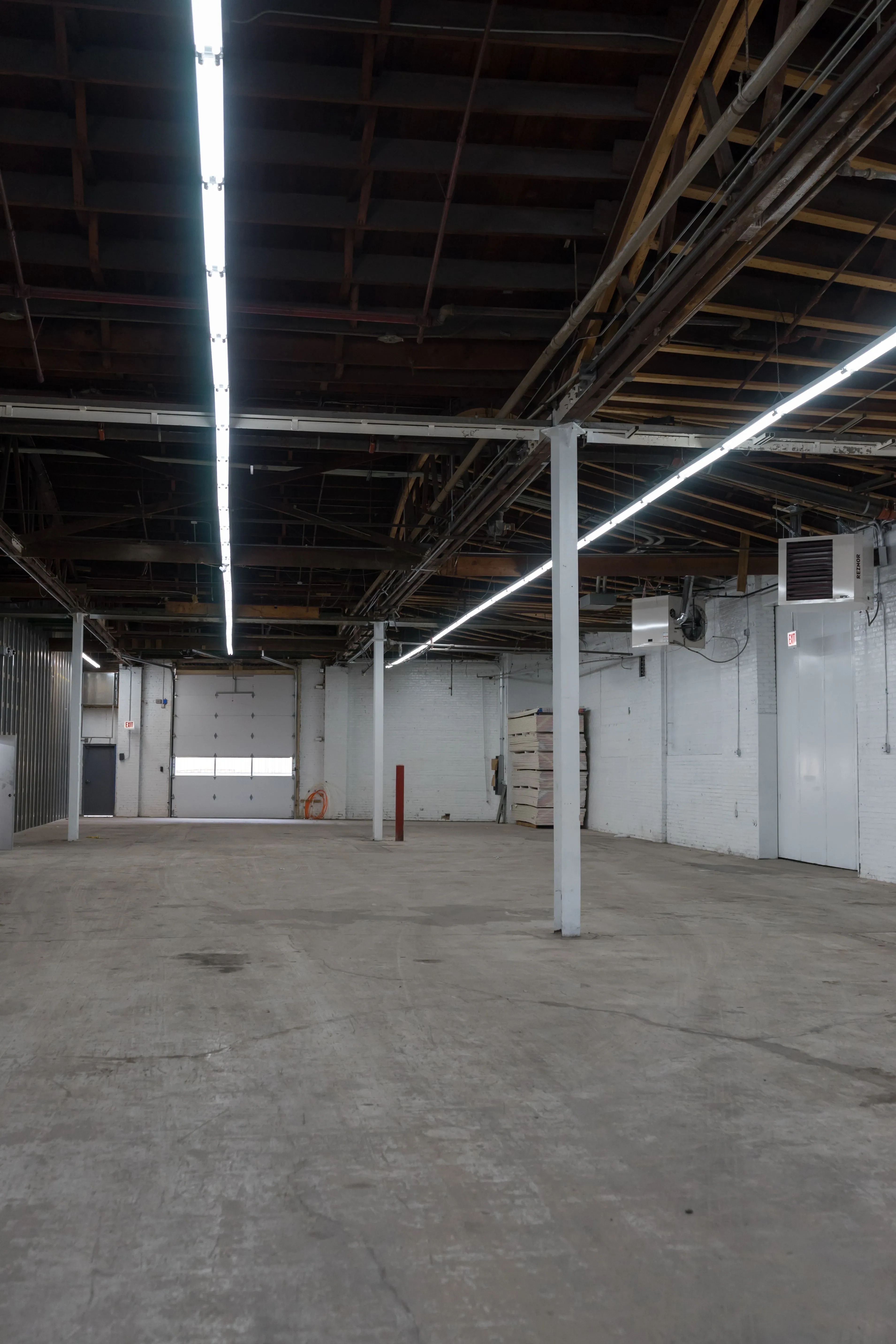 High-bay warehouse electrical conduit routing and LED retrofit by Wiring Experts in Schaumburg IL